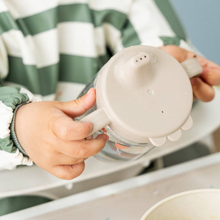 Leerbeker met tuit en handvatten Celebration Sand koop je bij Babywinkel